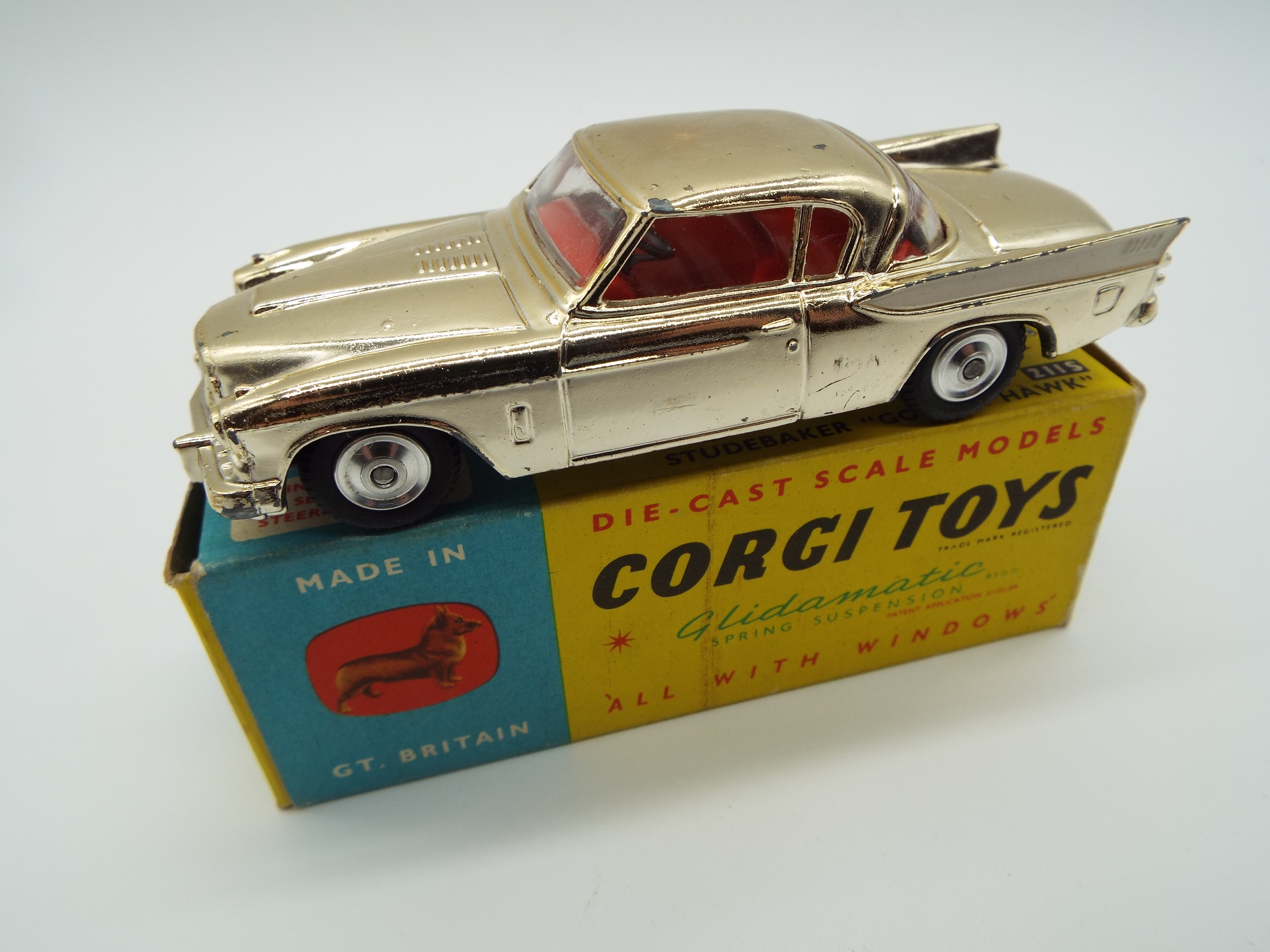 Corgi - a diecast model Studebaker 'Golden Hawk' metallic gold body, red interior, grey chassis,