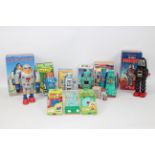 Tinplate Robots - Palitoy - Tomy - A collection of seven boxed wind-up modern Chinese made