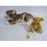 Steiff - A Steiff soft toy and Steiff bear - Lot includes a #0380/30 Steiff soft toy tiger with