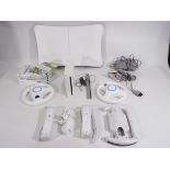 Nintendo - An unboxed Nintendo Wii console and Wii accessories to include two controllers,