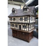Charles Jenner Dolls House - A large Tudor style wooden dolls house attributed to Charles Jenner of