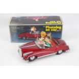 Chinese Tinplate - A boxed tinplate battery operated Chinese made "Photoing on Car".