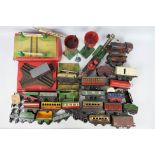 A collection of 33 Hornby O gauge items, loose and boxed in a playworn state.