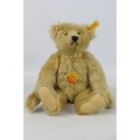 Steiff - A jointed blonde mohair Original Bear which stands approximately 30 cm tall, # 0168/32.