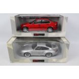 UT Models. 2 x 1:18 models appearing in Excellent condition with Excellent boxes.