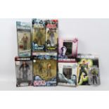 Eaglemoss - McFarlane Toys - Eight boxed 'The Walking Dead' action figures in various scales.