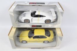 UT Models. 2 x 1:18 models appearing in Excellent condition with VG boxes.