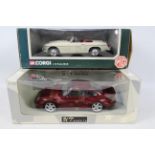 Corgi - UT Models. 2 x 1:18 scale models appearing in Excellent condition with VG boxes.
