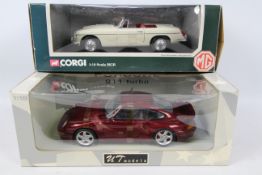 Corgi - UT Models. 2 x 1:18 scale models appearing in Excellent condition with VG boxes.