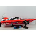 An unboxed 'Darter King' radio controlled racing boat.