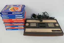 Mattel - A vintage Mattel Intellivision games console with 10 x boxed games including Astrosmash,