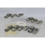 Danbury Mint - A collection of 12 Danbury Mint pewter 'Jagura' model vehicles from the Classic