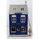 Dolls House - A scratch built wooden three storey illuminated dolls house depicting a photographic