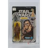 Kenner - Star Wars - Graded Figure - An AFA graded 1978 Kenner Chewbacca figure on card,