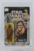 Kenner - Star Wars - Graded Figure - An AFA graded 1978 Kenner Chewbacca figure on card,