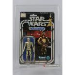 Kenner - Star Wars - Graded Figure - An AFA graded 1978 Kenner C-3PO figure on card,
