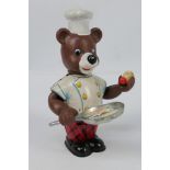 Yonezawa - An unboxed circa 1950's tinplate wind-up 'Teddy Cook'.