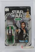 Kenner - Star Wars - Graded Figure - An AFA graded 1978 Kenner Han Solo small head figure on card,