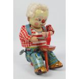 Alps (Japan) - An unboxed tinplate 'Mechanical Paddy The Leprechaun Shoemaker' wind-up toy.