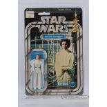 Kenner - Star Wars - Graded Figure - A UKG graded 1978 Kenner Princess Leia Organa figure on card,