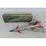 A boxed vintage tinplate friction powered #MF101 ' 'Rocket Plane'.