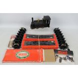 Mamod - An unboxed Steam Locomotive with a quantity of boxed and loose track sections.