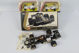 Corgi - 3 x boxed Formula 1 cars,