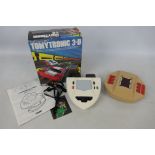 Tomy - Parker - 2 x vintage hand held games, a boxed Tomytronic 3-D Thundering Turbo # 7617.