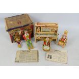 Unique Art Manufacturing- A rare boxed clockwork tinplate Li'l Abner and his Dogpatch Band.