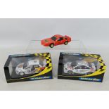 Scalextric - Two boxed and one unboxed Scalextric slot cars.