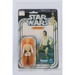 Kenner - Star Wars - Graded Figure - A UKG graded 1978 Kenner Luke Skywalker figure on card,