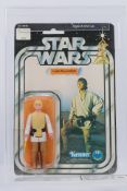 Kenner - Star Wars - Graded Figure - A UKG graded 1978 Kenner Luke Skywalker figure on card,