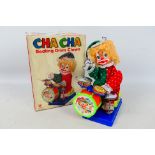 San Ai Toys - A boxed vintage battery operated Cha Cha Beating Drum Clown # SA-140P.