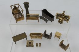 Unknown maker - An unboxed group of unmarked bronze dolls house furniture.