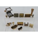 Unknown maker - An unboxed group of unmarked bronze dolls house furniture.