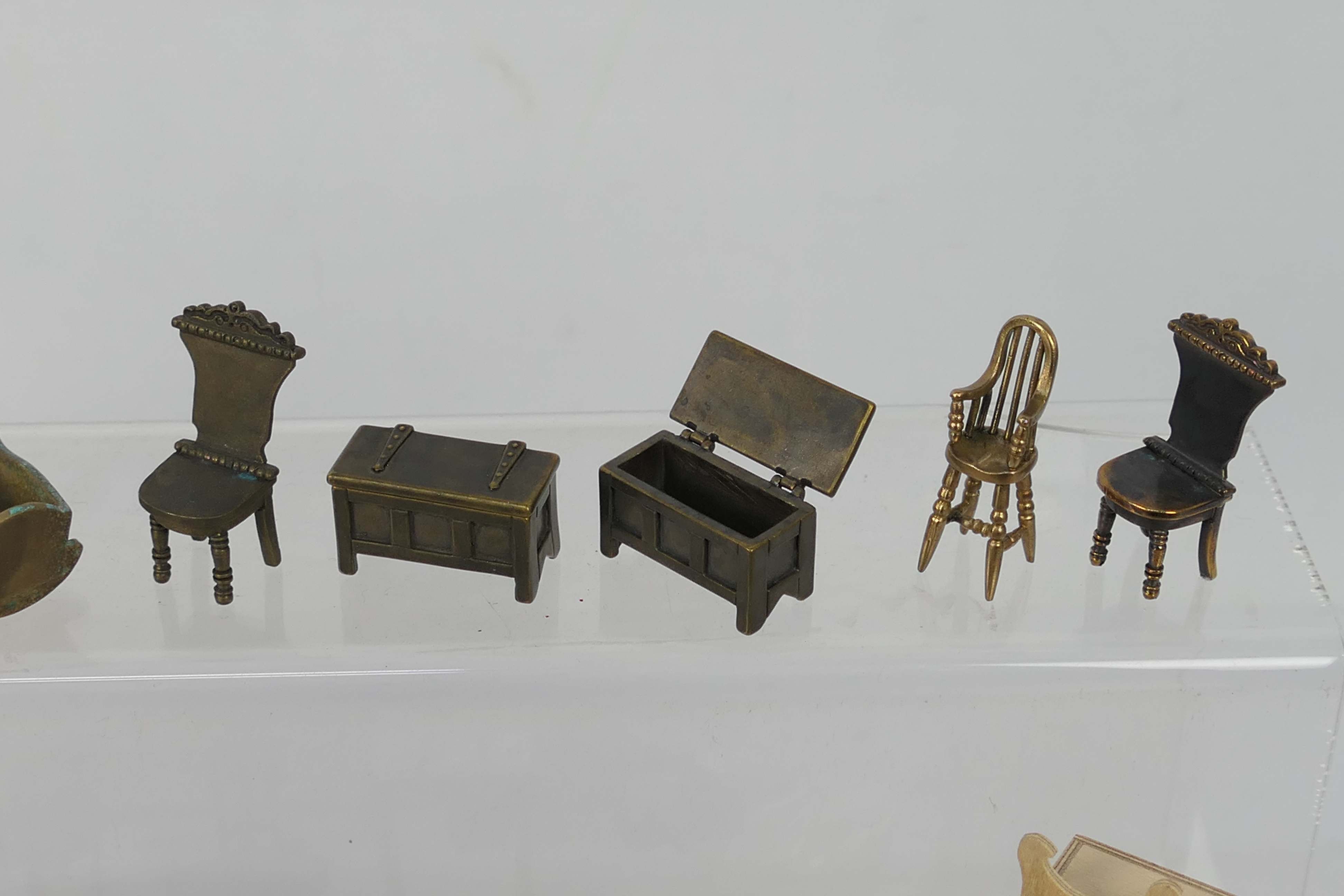 Unknown maker - An unboxed group of unmarked predominately bronze dolls house furniture. - Image 7 of 9