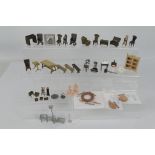 Unknown maker - An unboxed group of unmarked predominately bronze dolls house furniture.