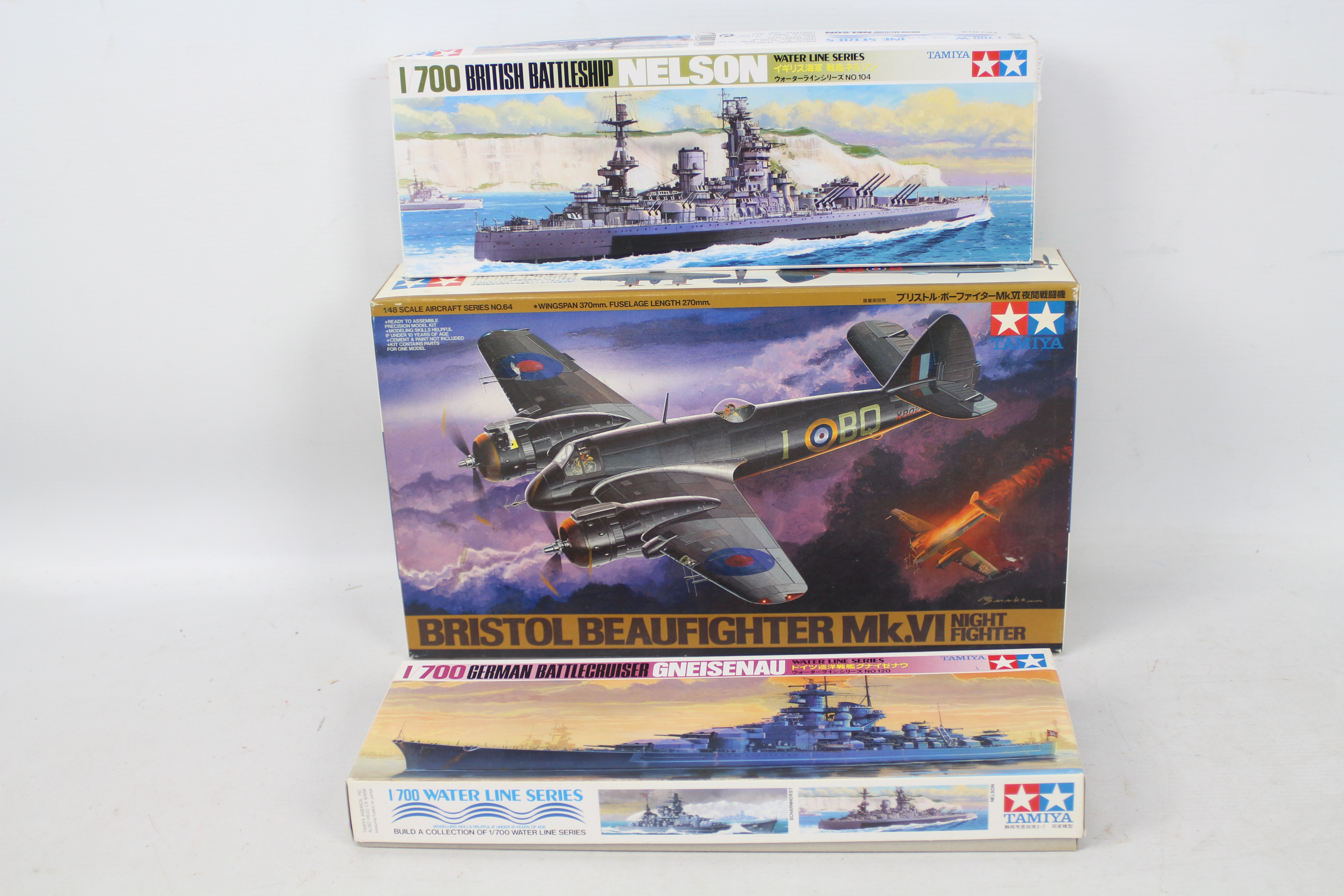 Tamiya - Three boxed plastic model kits in various scales from Tamiya.