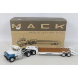 First Gear - A boxed First Gear 1:34 scale R-Model Mack with Lowboy Trailer diecast model truck.