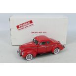 Danbury Mint - A boxed 1:24 scale diecast 1940 Ford Deluxe Coupe by Danbury Mint.