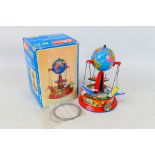 Wilesco - A boxed Globe Carousel with three aircraft for use with a Wilesco or Mamod steam engine.