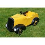 Tri-ang - A rare 1950s pressed steel Tri-ang Model 40 pedal car repainted in yellow.