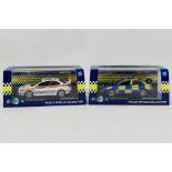 Model Icons - Two boxed 1:43 scale Limited Edition diecast Mitsubishi Lancer police cars from Model