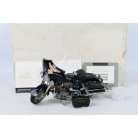 Franklin Mint - A boxed 1:10 scale Franklin Mint 'The Harley Davidson Electra Glide Motorcycle'.