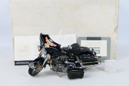 Franklin Mint - A boxed 1:10 scale Franklin Mint 'The Harley Davidson Electra Glide Motorcycle'.