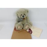 Charlie Bears - "Olga" CB124934, 2012. Dove grey plush, with blue stitched nose.