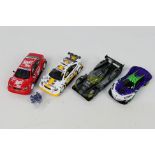 Scalextric - 4 x unboxed slot cars, 2 x Opel Astra Coupe models, a Batmobile and a Joker's car.