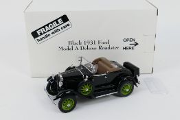 Danbury Mint - A boxed Danbury Mint 1:24 scale Black 1931 Ford Model A Deluxe Roadster.