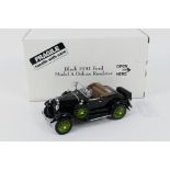 Danbury Mint - A boxed Danbury Mint 1:24 scale Black 1931 Ford Model A Deluxe Roadster.