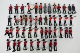 Britains - A collection of figures including 8 x un detailed Guards, 6 x Guards in firing position,